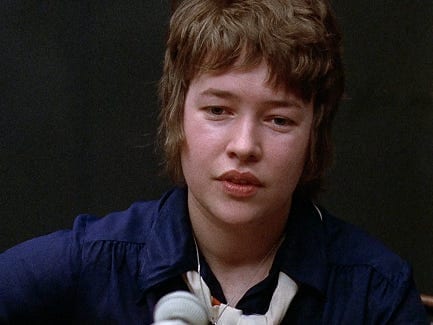 A person with a microphone
Description automatically generated